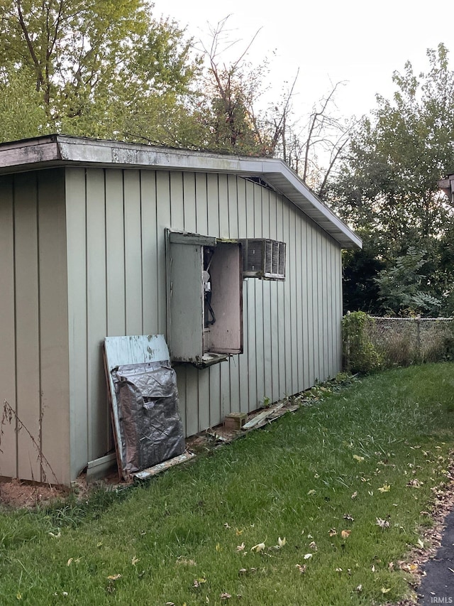 view of outbuilding with a lawn