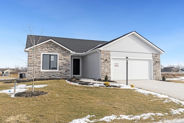 602 Zion Hill Rd, Ligonier, IN 46767 - ranch-style home with stone siding, roof with shingles, concrete driveway, an attached garage, and a lawn