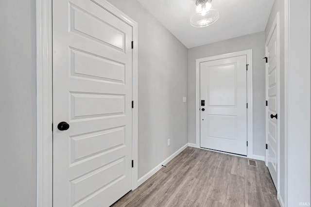 602 Zion Hill Rd, Ligonier, IN 46767 - entryway with baseboards and light wood-style floors