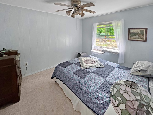 bedroom with light carpet and ceiling fan