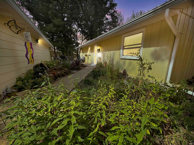 view of property exterior at dusk