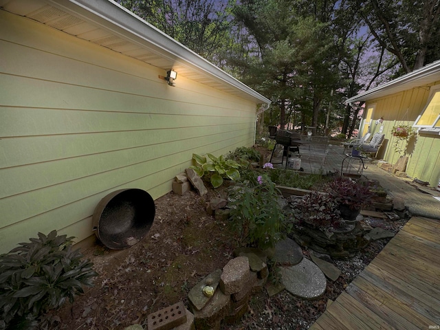 view of property exterior with a patio