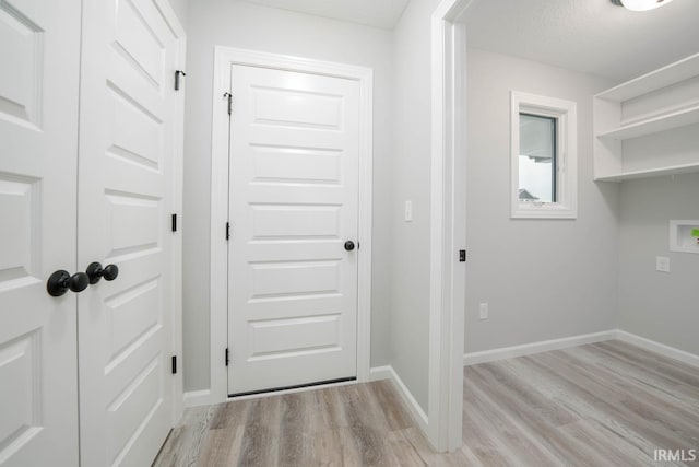 interior space featuring a textured ceiling and light hardwood / wood-style floors