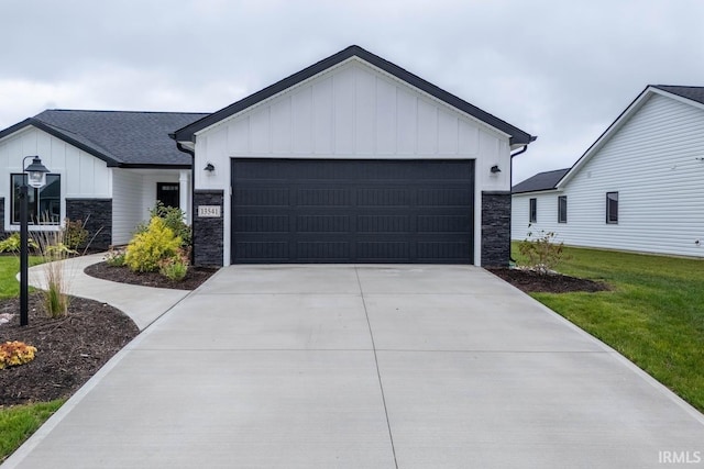 modern farmhouse style home featuring a front lawn and a garage