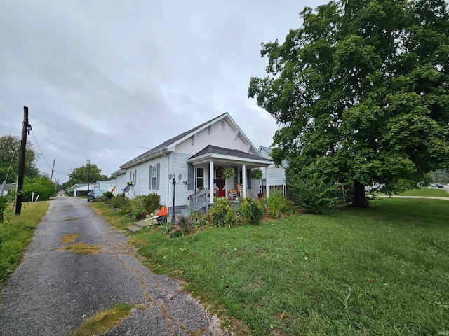 bungalow featuring a front yard and a porch