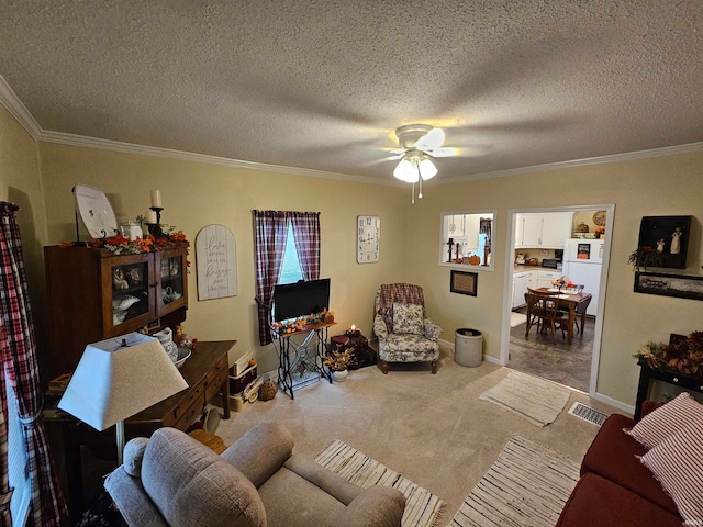 carpeted living room with ornamental molding, ceiling fan, and a textured ceiling