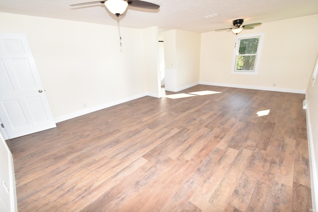 unfurnished room featuring ceiling fan and hardwood / wood-style floors