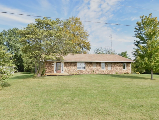 back of house with a lawn