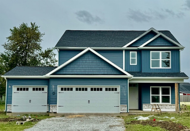 craftsman house with a porch and a garage