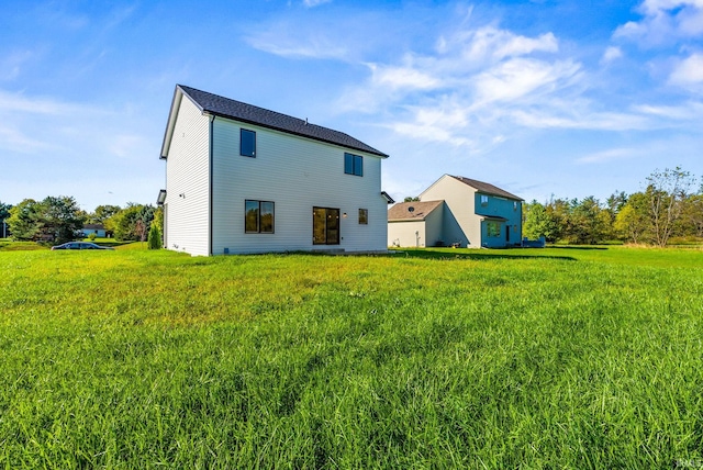 back of house featuring a yard