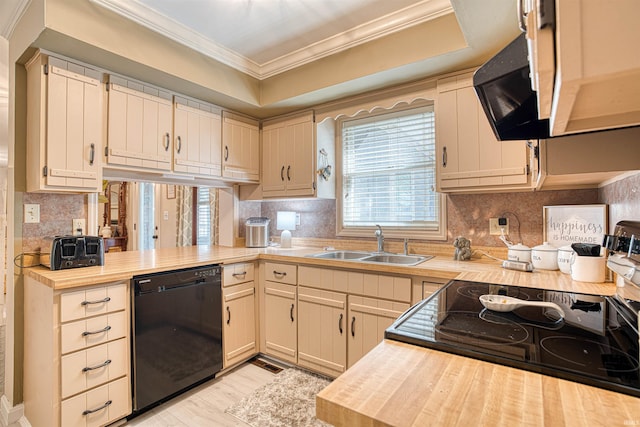 kitchen with light hardwood / wood-style floors, dishwasher, crown molding, cream cabinets, and sink