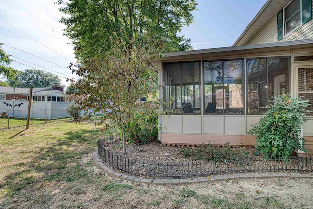 view of yard featuring a sunroom