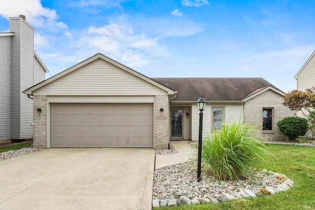 ranch-style home featuring a front lawn and a garage