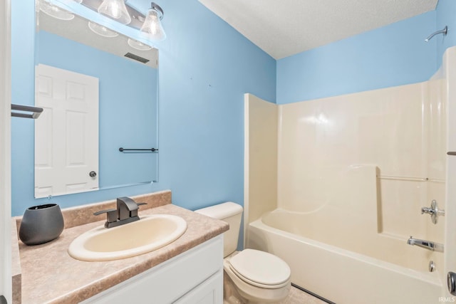 full bathroom featuring shower / tub combination, a textured ceiling, vanity, and toilet