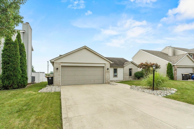 ranch-style home with a front yard and a garage