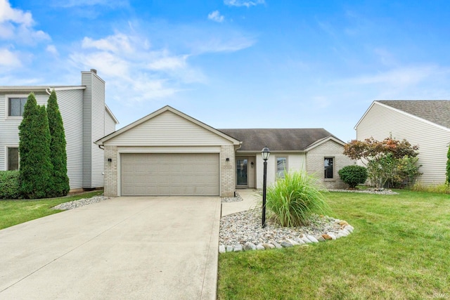 view of front of home with a front yard and a garage