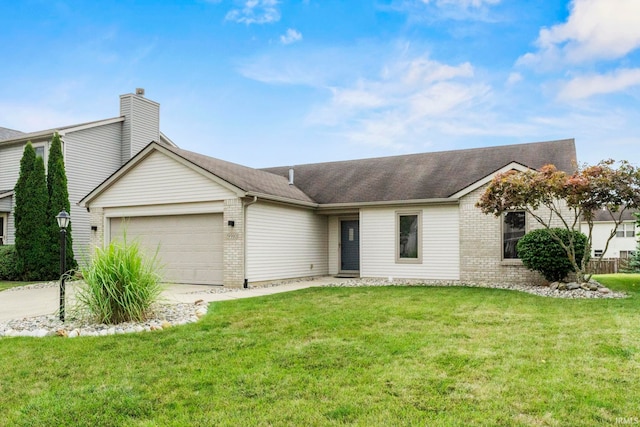 single story home featuring a garage and a front lawn