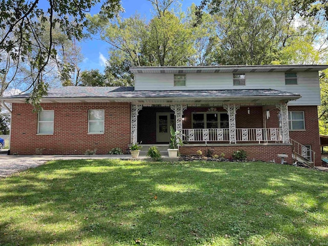 view of front of home with a front yard and covered porch