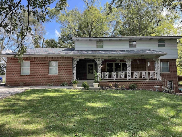 5405 S Fairfax Rd, Bloomington, IN 47401 - traditional home with brick siding, a porch, and a front lawn