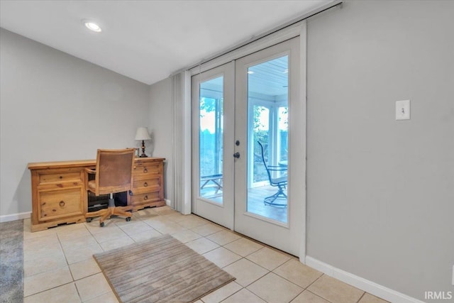 entryway with french doors and light tile patterned floors