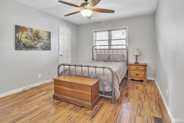 bedroom featuring light wood-type flooring and ceiling fan