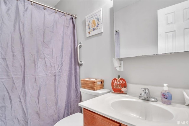 bathroom with vanity and toilet