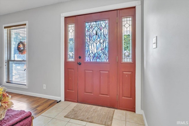 foyer entrance with light tile patterned flooring