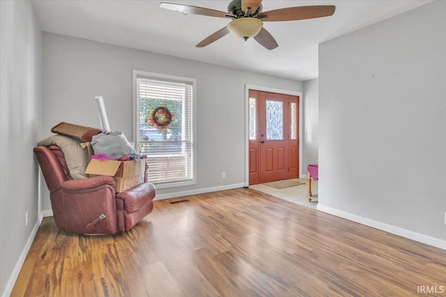 foyer entrance featuring light hardwood / wood-style flooring and ceiling fan