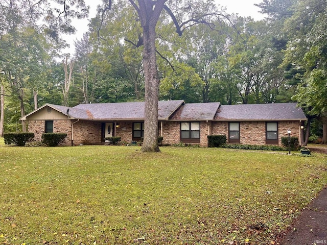 ranch-style house with a front lawn