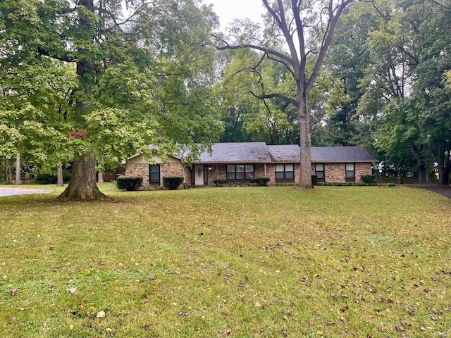 ranch-style house with a front lawn