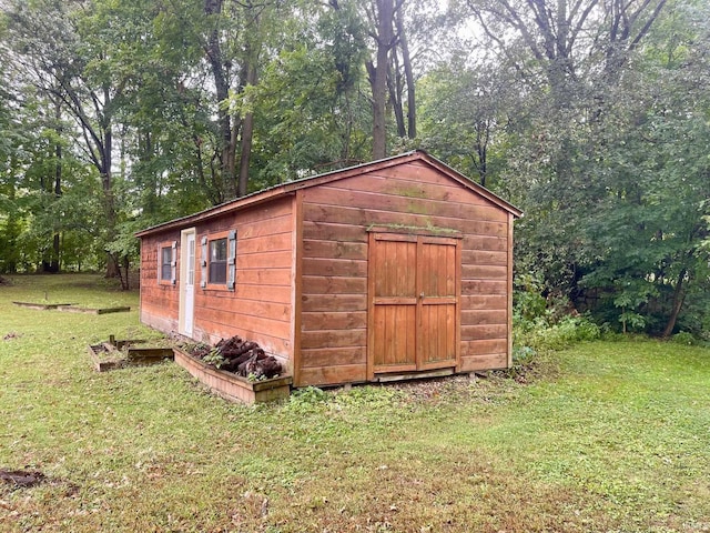 view of outdoor structure with a lawn