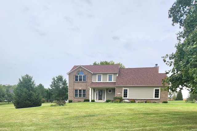 view of front of home with a front lawn