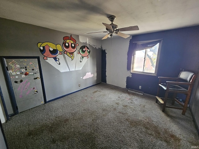 unfurnished bedroom with ceiling fan and carpet floors