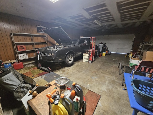 garage featuring wooden walls