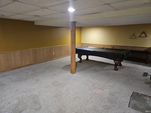 playroom featuring carpet, wood walls, pool table, and a drop ceiling