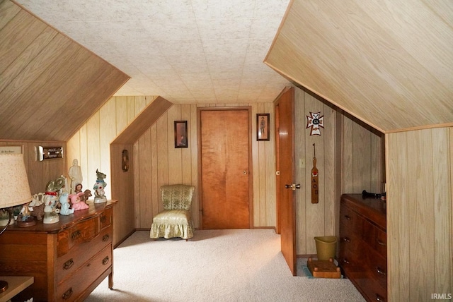 interior space featuring wood walls and vaulted ceiling