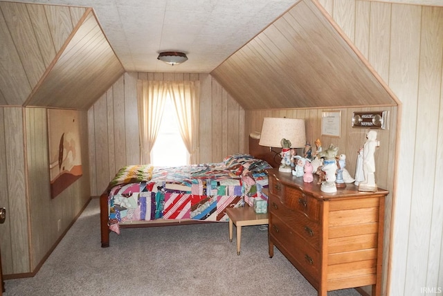 bedroom featuring vaulted ceiling, wooden walls, and carpet flooring