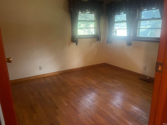 empty room featuring hardwood / wood-style floors