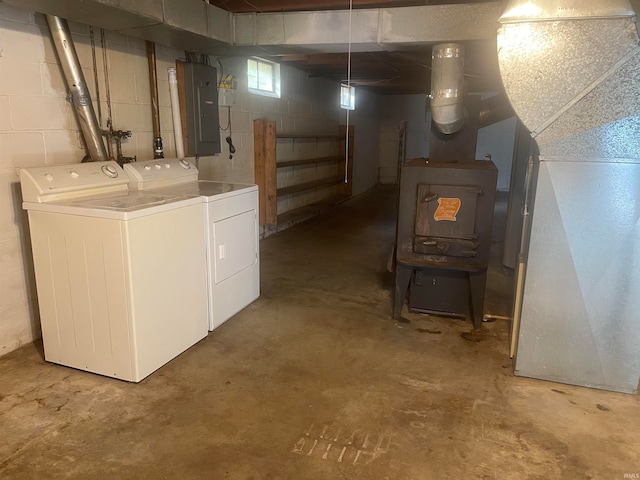 basement featuring electric panel and independent washer and dryer