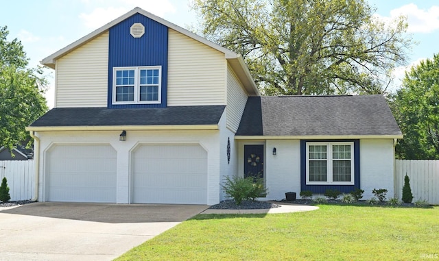 view of front of home with a garage and a front lawn