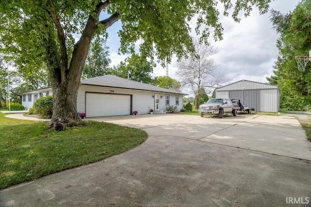 view of front of house with a garage and a front yard