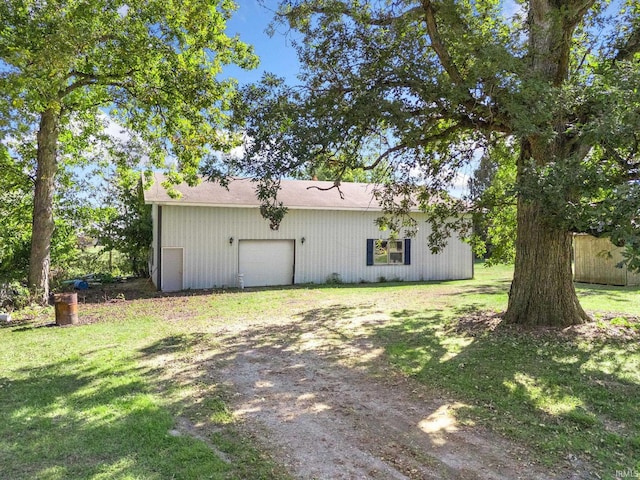 rear view of property with a yard