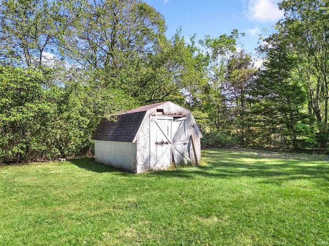 view of outdoor structure with a lawn