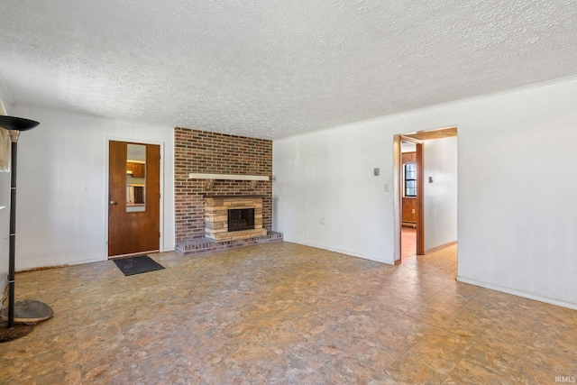 unfurnished living room featuring a brick fireplace and a textured ceiling