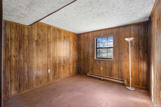 unfurnished room with a textured ceiling, wooden walls, and baseboard heating