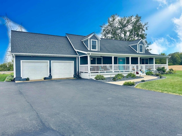 cape cod-style house with a garage, a front lawn, and a porch