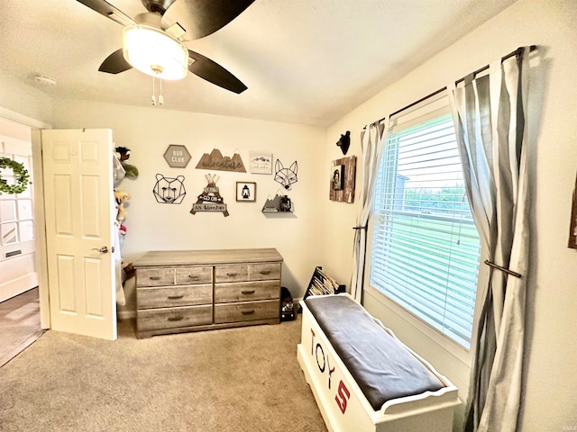 carpeted bedroom featuring ceiling fan