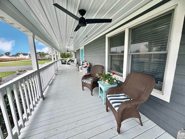 wooden deck with ceiling fan and covered porch