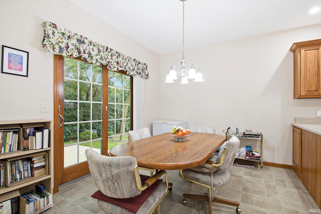 dining room featuring plenty of natural light and a chandelier