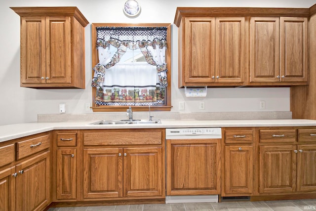 kitchen with white dishwasher and sink